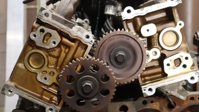 Timing gears and cylinder heads on the bench